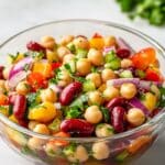 Juicy 3 bean salad with green beans, kidney beans, and chickpeas in vinaigrette.