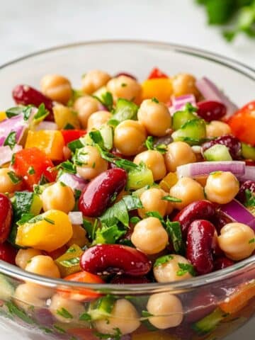 Juicy 3 bean salad with green beans, kidney beans, and chickpeas in vinaigrette.