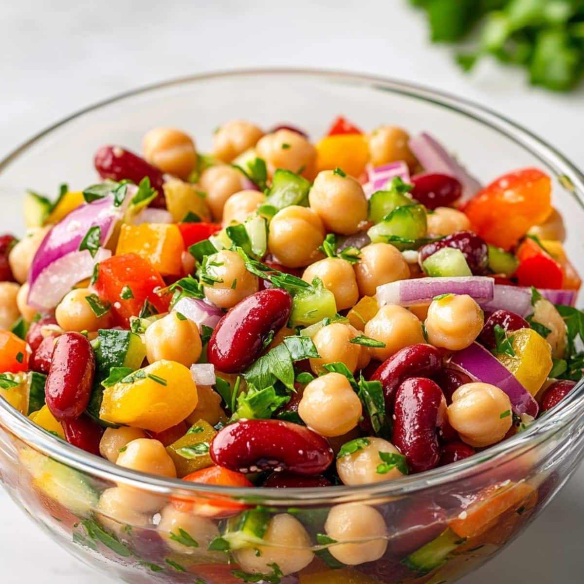 Juicy 3 bean salad with green beans, kidney beans, and chickpeas in vinaigrette.
