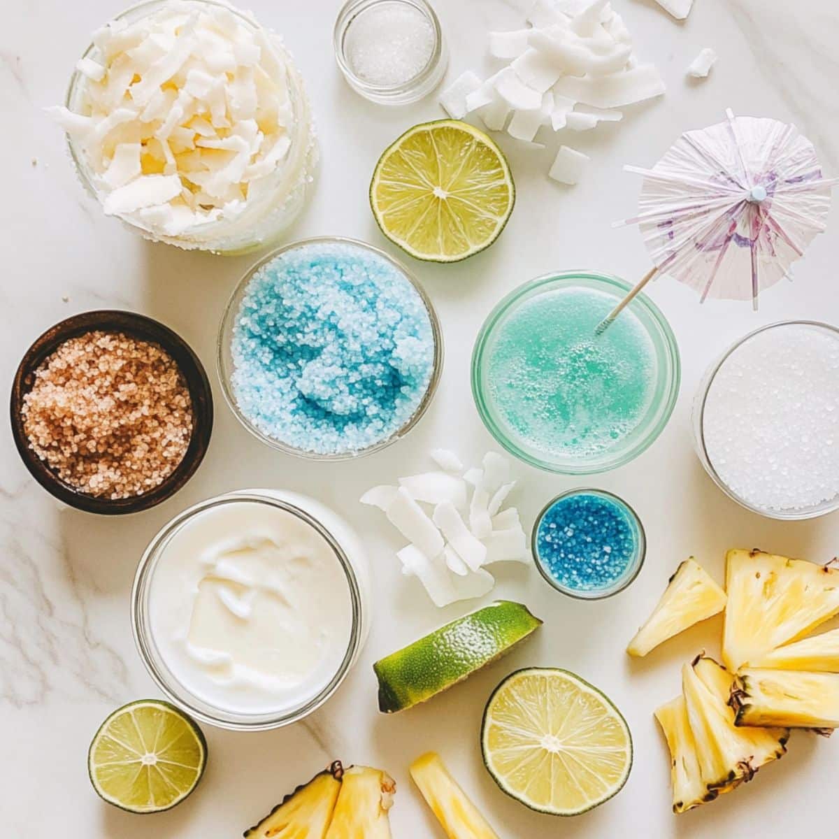 All mermaid cocktail ingredients laid out casually on a white kitchen counter. Homemade feel with vibrant tropical elements.