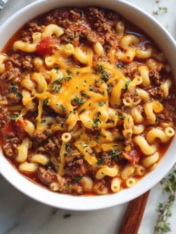 Hearty American goulash with elbow pasta and ground beef in tomato sauce.