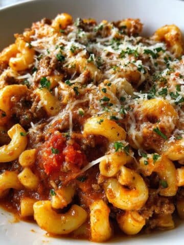 plate of beefaroni with elbow macaroni, savory ground beef, rich tomato sauce, and melted Parmesan cheese.