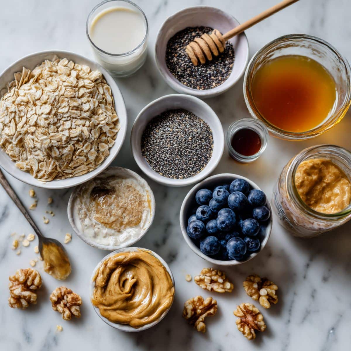 Flat lay of homemade blended oats recipe ingredients including oats, yogurt, berries, and maple syrup. Easy breakfast prep with real kitchen ingredients.