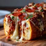 Cheesy stuffed garbage bread with pepperoni, sausage, and melted mozzarella.