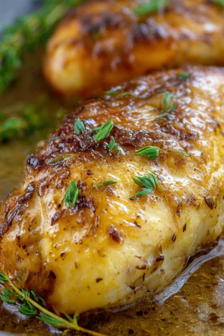 Golden maple dijon chicken breast glazed with sweet mustard sauce and fresh thyme.