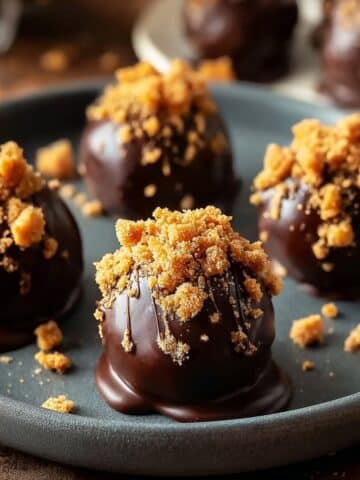 Chocolate-covered Biscoff cookie butter truffles topped with crunchy cookie crumbs