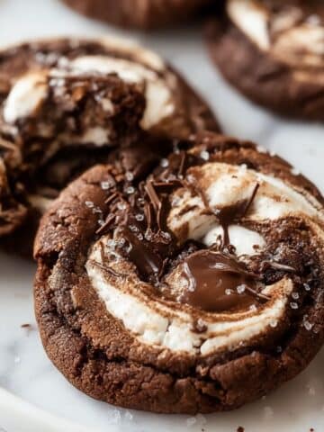 Chocolate marshmallow swirl cookies with rich chocolate dough and soft marshmallow spirals baked into chewy pinwheel cookies.