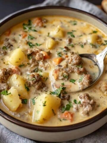 Crockpot creamy potato and hamburger soup with tender potatoes and seasoned ground beef