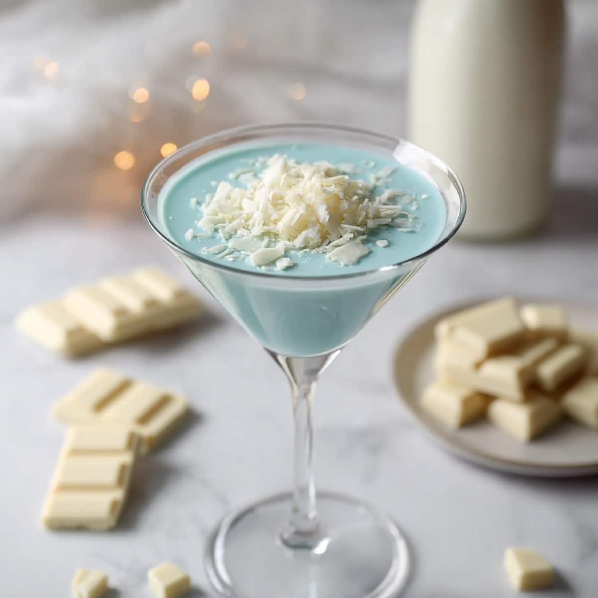 Easy Cloud Nine martini topped with white chocolate shavings in a chilled cocktail glass