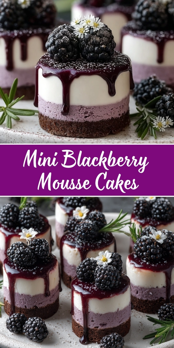 Mini blackberry mousse cakes with three layers - chocolate brownie base, purple blackberry mousse, and white cream top - drizzled with dark berry sauce and garnished with fresh blackberries, small white flowers, and rosemary sprigs on a speckled plate.