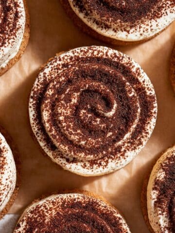 Tiramisu cookies with mascarpone frosting and cocoa powder swirl on top