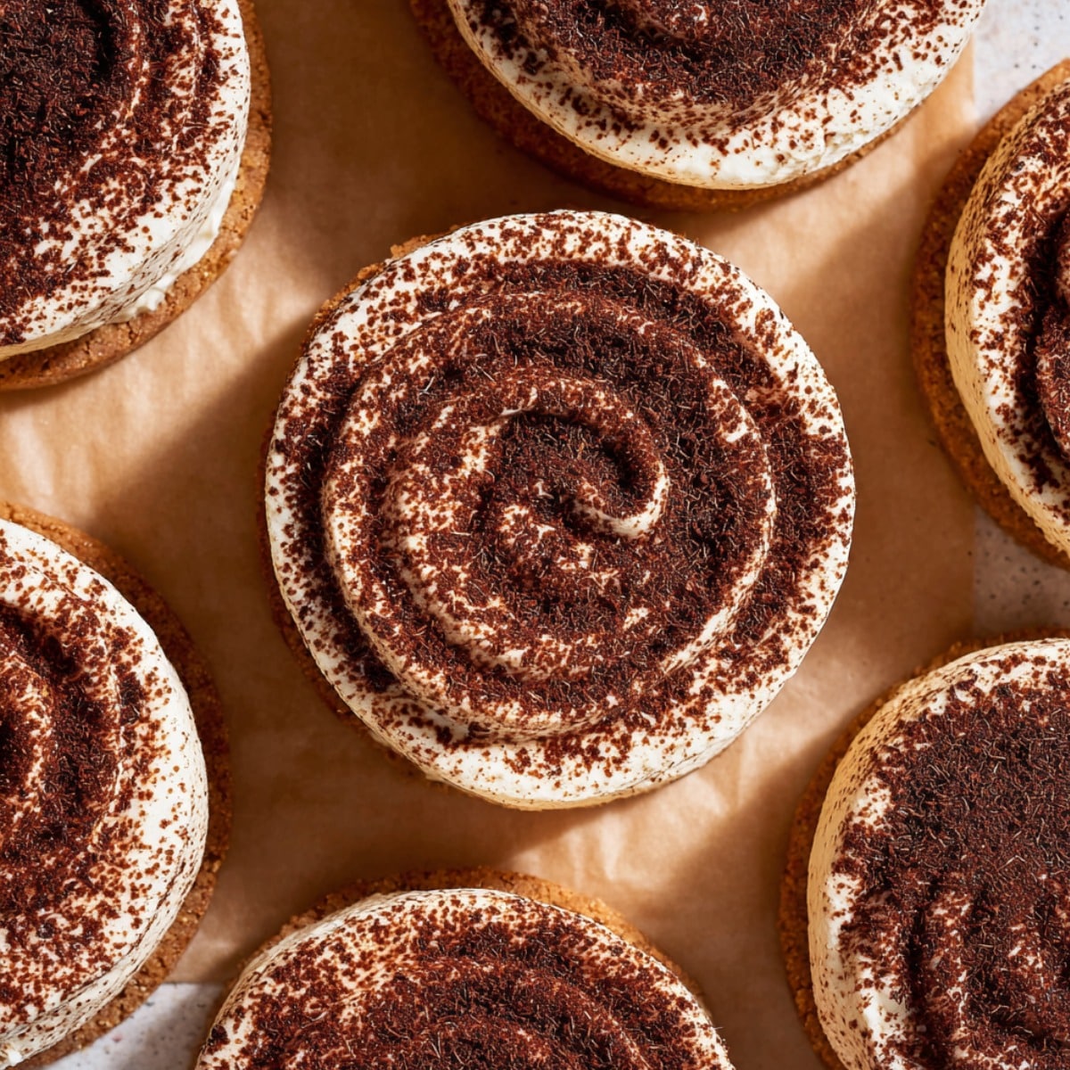 Tiramisu cookies with mascarpone frosting and cocoa powder swirl on top