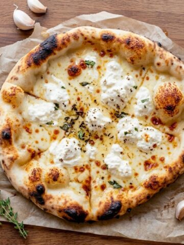An overhead top-down view of White Sauce Pizza Simmering Garlic Cream.
